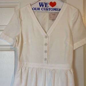 Gal Meets Glam white linen dress with ruffle hem